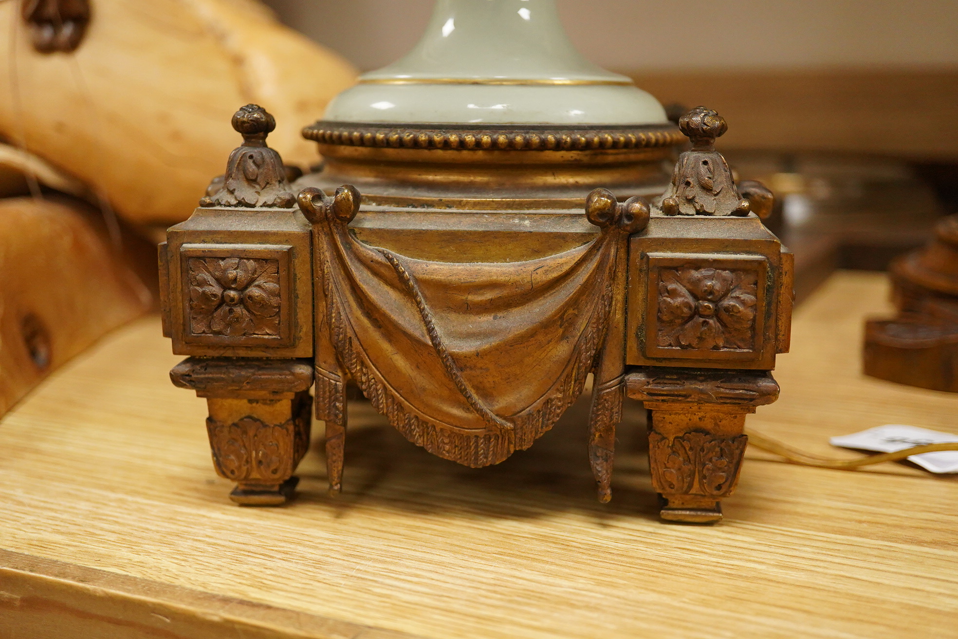 A French Sevres style porcelain and ormolu table lamp, with central decoration of a lyre amongst foliage, 49cm